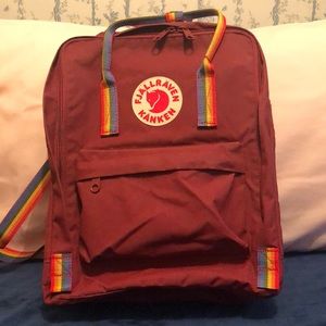Red Fjällraven Kaken backpack in Red with Rainbow stripe.